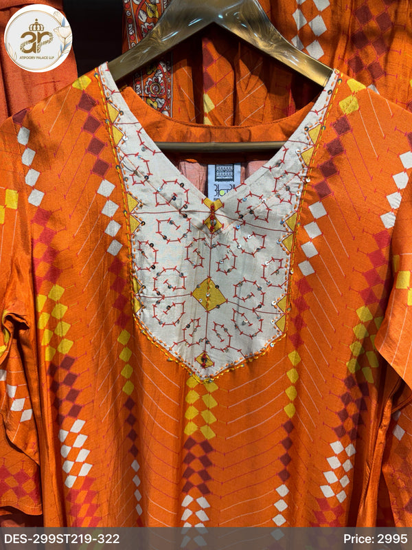 Orange traditional outfit with white embroidered neckline on a hanger
